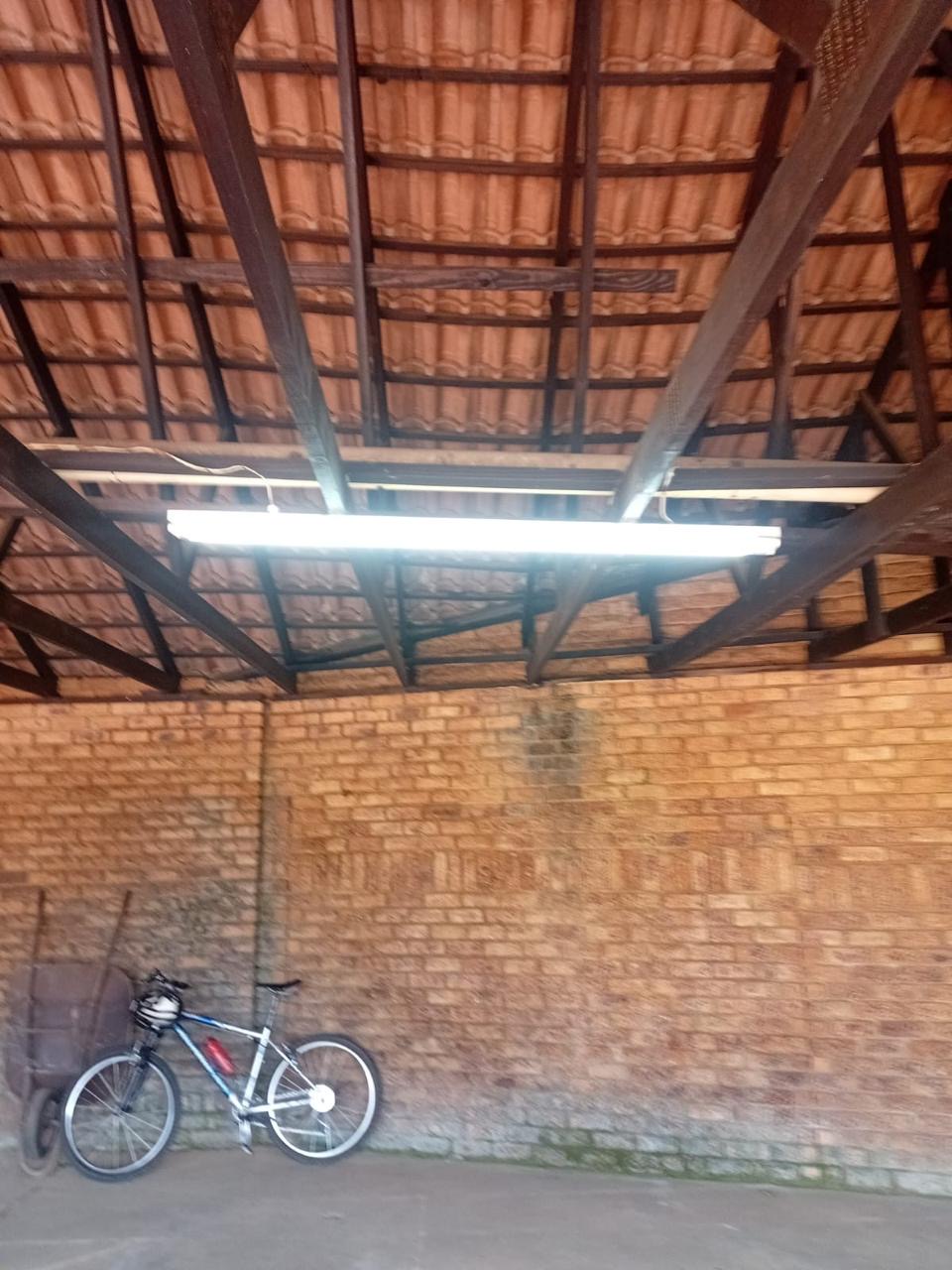 Fluorescent tube light fitted under a tiled roof in a garage and carport by Happ's Electrical