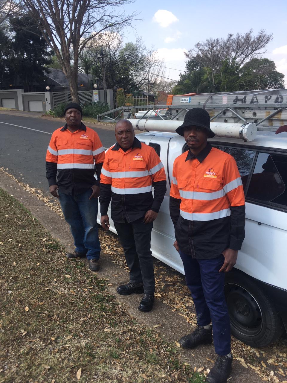 Happ's Electrical team on a residential street in Gauteng next to their service vehicle